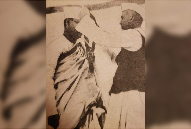 Nehru passes the presidential medal to Bose at the Congress township in Haripura
