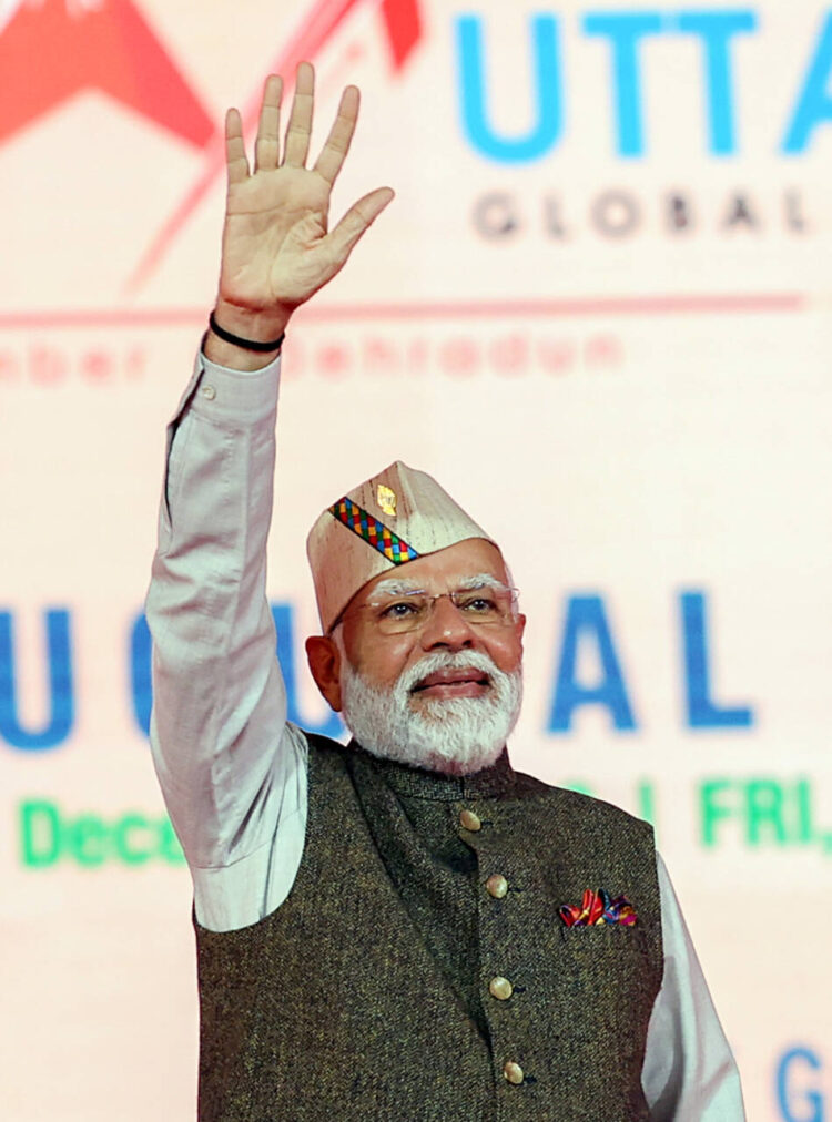 Dehradun, Dec 08 (ANI): Prime Minister Narendra Modi greets at the inauguration of the Global Investors Summit 2023, in Dehradun on Friday. (ANI Photo)