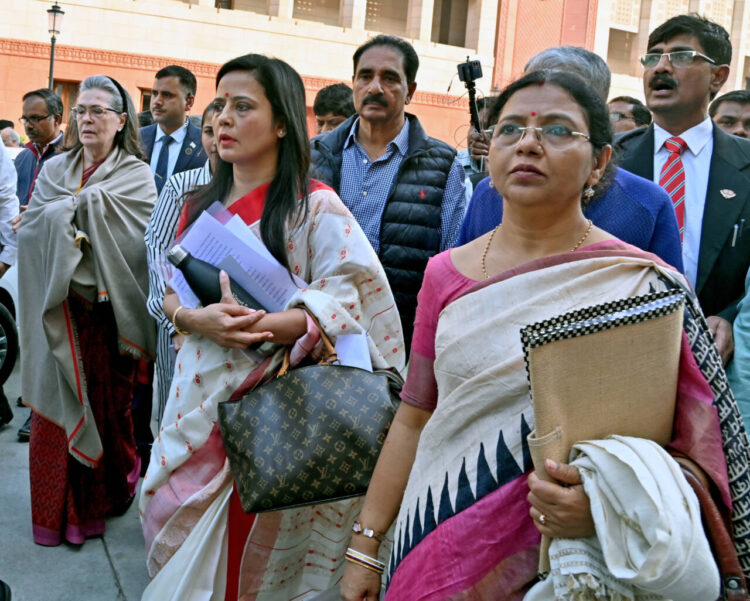 New Delhi, Dec 08 (ANI): Opposition MPs Sonia Gandhi, Mahua Moitra, and others walking out from Lok Sabha against the motion to expel Moitra was passed in the House, in New Delhi on Friday. (ANI Photo/Sanjay Sharma)