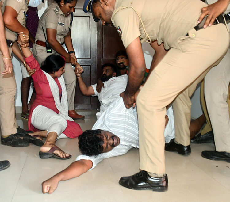 Thiruvananthapuram, Dec 12 (ANI): Police personnel detain Youth Congress supporters who tried to barge into the Travancore Devaswom Board headquarters while protesting against the alleged failure in crowd control at Sabarimala Lord Ayyappa temple, in Thiruvananthapuram on Tuesday. (ANI Photo)