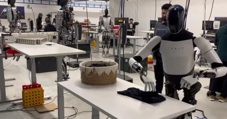 Elon Musk Unveils Tesla's Optimus Robot Folding Shirts in Video