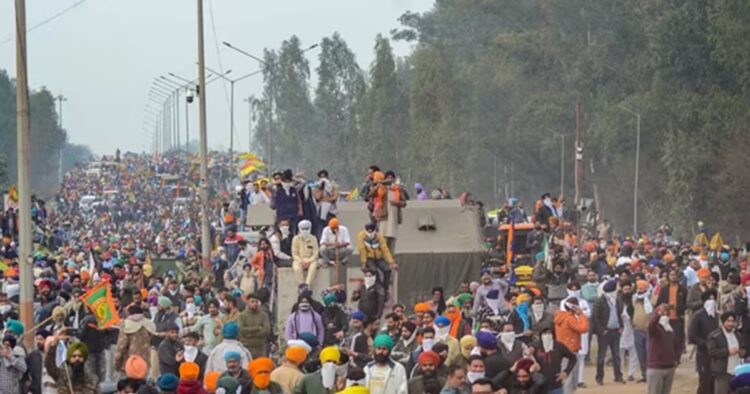 Farmers are throwing police barricades down from the flyover at Shmabhu on the Punjab-Haryana border as they march towards Delhi to press for their demand.