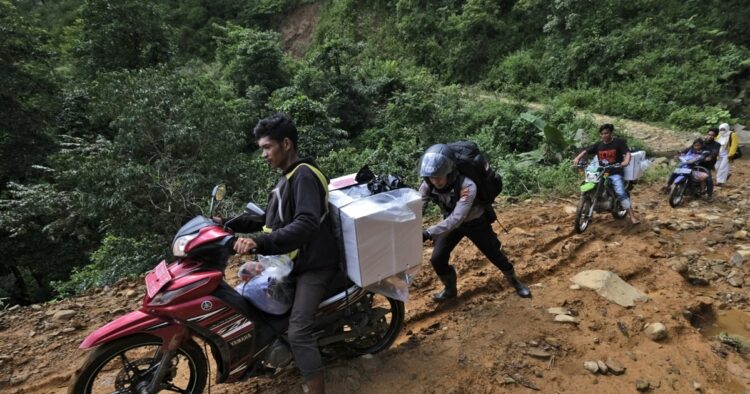 Nearly 205 million eligible voters of Indonesia choose candidates in this Wednesday’s election. Iconic white ballot boxes and ballots have been carried across the world’s largest archipelago by motorcycle, boat and even horse — as well as on foot.