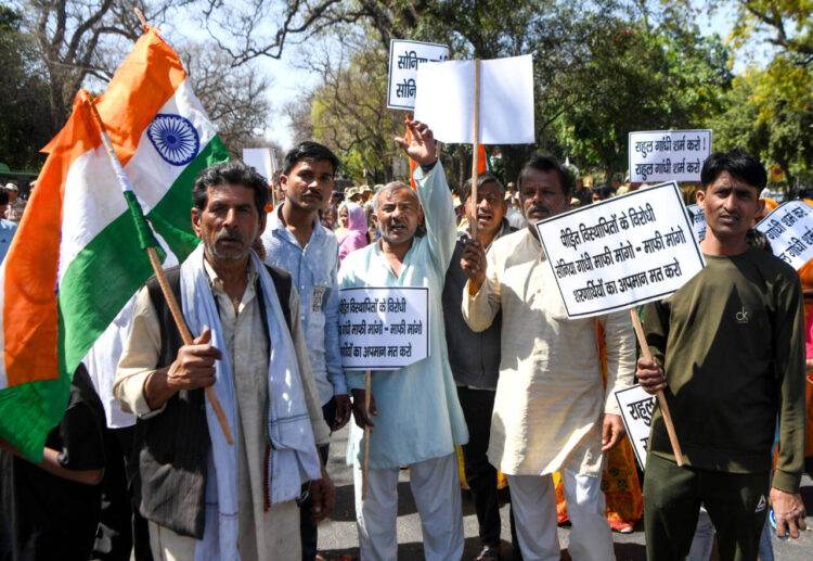 New Delhi, Mar 15 : Refugees from Pakistan and Afghanistan stage a protest against Congress over their alleged anti-CAA remarks, near AICC headquarters in New Delhi on Friday.