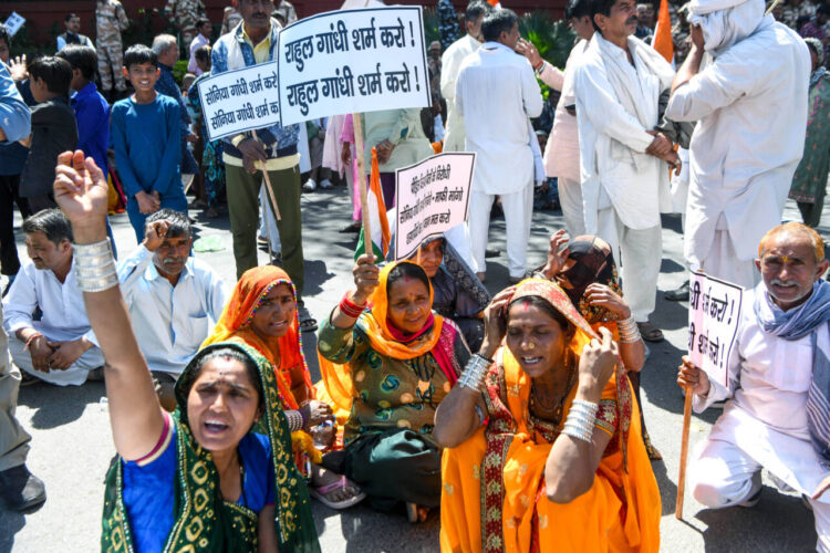 New Delhi, Mar 15: Refugees from Pakistan and Afghanistan stage a protest against Congress over their alleged anti-CAA remarks, near AICC headquarters in New Delhi on Friday.