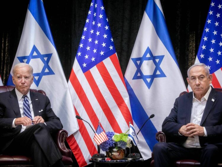 US President Joe Biden (L), sits with Israeli Prime Minister Benjamin Netanyahu, at the start of the Israeli war cabinet meeting, in Tel Aviv on October 18, 2023, amid the ongoing battles between Israel and the Palestinian group Hamas. US President Joe Biden landed in Tel Aviv on October 18, 2023 as Middle East anger flared after hundreds were killed when a rocket struck a hospital in war-torn Gaza, with Israel and the Palestinians quick to trade blame. (Photo by Miriam Alster / POOL / AFP) (Photo by MIRIAM ALSTER/POOL/AFP via Getty Images)