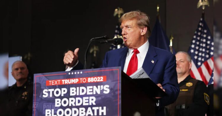 Donald Trump reiterated his criticized warning of a coming American ‘bloodbath’ Tuesday as he told supporters US communities faced ‘sacking, rape and slaughter’ at the hands of illegal immigrants.