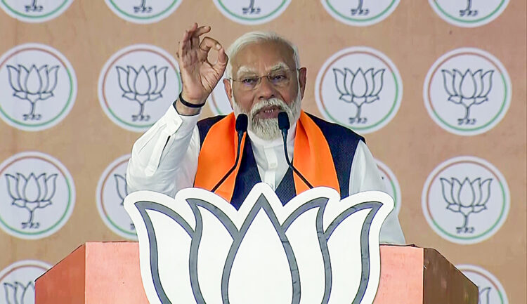 Deesa [Gujarat], May 1 : Prime Minister Narendra Modi addresses a public meeting for the third phase of the Lok Sabha polls, in Deesa on Wednesday.