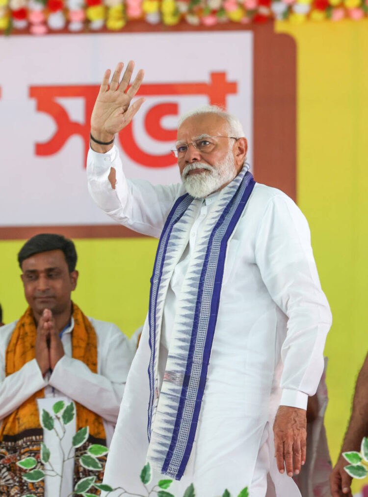 Bolpur, May 3: Prime Minister Narendra Modi waves to the gathering during a public meeting in support of the Bharatiya Janata Party (BJP) candidate from Priya Saha for the third phase of the Lok Sabha elections, in Bolpur on Friday.