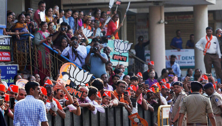 Ahmedabad, May 07 : Bharatiya Janata Party (BJP) supporters gather as Prime Minister Narendra Modi arrives to cast his vote for the Lok Sabha polls 2024, in Ahmedabad on Tuesday.