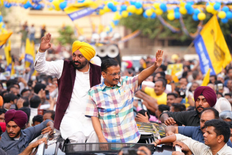 New Delhi, May 12: Delhi Chief Minister Arvind Kejriwal and Punjab Chief Minister Bhagwant Mann holding a roadshow for the Lok Sabha Polls, at Moti Nagar, in New Delhi on Sunday.