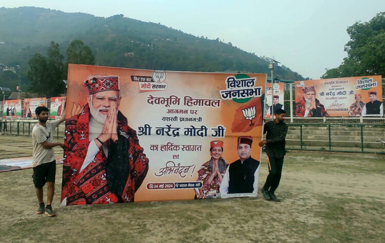 Mandi, May 23: Hoardings are being put up at Paddal Ground ahead of Prime Minister Narendra Modi's public rally, in Mandi on Thursday.