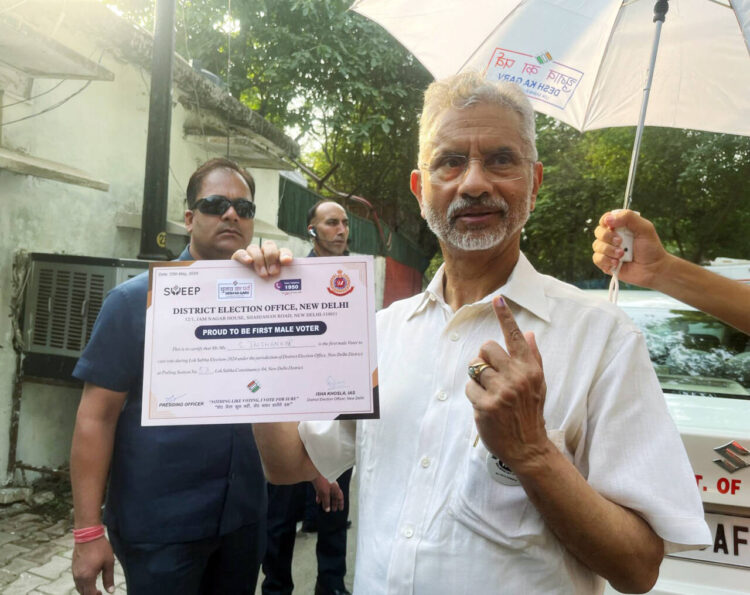 New Delhi, May 25 : External Affairs Minister S Jaishankar shows his ink-marked finger after casting his vote for the sixth phase of the Lok Sabha elections 2024, in New Delhi on Saturday.  S Jaishankar receives a certificate as he happens to be the first male voter at his designated polling booth.