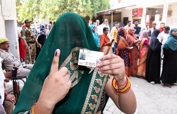 Prayagraj, May 25 : A woman shows her ink-marked finger after casting her vote during the sixth phase voting of the Lok Sabha elections, at a polling station in Prayagraj on Saturday.