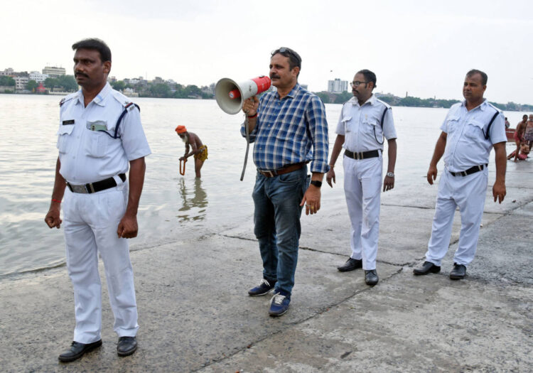 Kolkata, May 25: Kolkata police alert people of the impending Cyclone Remal, at Nimtala ghat in Kolkata on Saturday