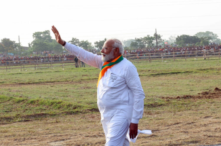 Kendrapara, May 29 : Prime Minister Narendra Modi waves to the supporters during a public meeting for the Lok Sabha and Odisha Assembly polls, in Kendrapara on Wednesday.