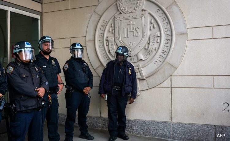 Dozens of police cars patrolled at the University of California, Los Angeles campus in response to violent clashes overnight