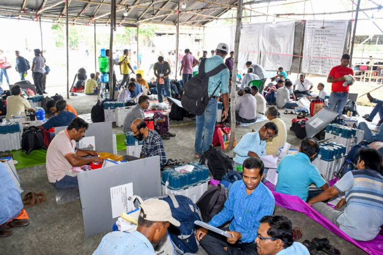 North 24 Parganas, May 30: Polling officials check the electronic voting machines (EVM) and other election materials before leaving for the polling stations for the last phase of the Lok Sabha polls, at the dispersal centre in North 24 Parganas on Thursday.