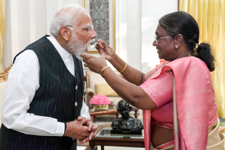 New Delhi, Jun 7 : Prime Minister-designate Narendra Modi being offered sweet curd by President Droupadi Murmu during a meeting as he stakes claim to form the government as leader of the National Democratic Alliance (NDA) Parliamentary Party, at Rashtrapati Bhavan, in New Delhi on Friday. The President appointed him as PM-designate and he will take oath for the third consecutive time on 9th June.