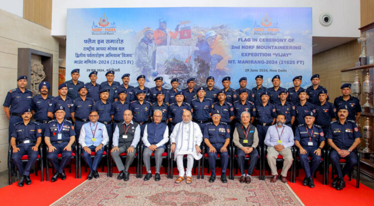 New Delhi, June 29 : Union Home Minister Amit Shah poses for a group picture during the NDRF Flag-in ceremony of the second Mountaineering Expedition 'Vijay', at Adarsh Auditorium, Delhi Police HQ in New Delhi on Saturday.