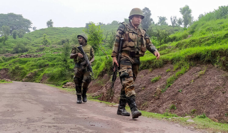 Rajouri, Jul 22: Security personnel stand guard during an anti-terrorist operation after the recent terror attack on an Army picket, at Gunda Village in Rajouri, on Monday. Reportedly, one soldier has been seriously injured in the attack.