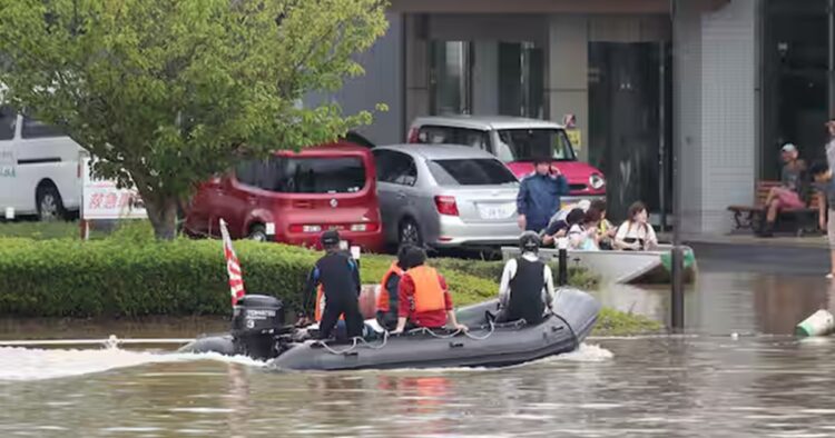 Heavy rain led rivers to overflow, washing away bridges and cars and forcing the evacuation of thousands of people across parts of northern Japan, according to the media reports. 