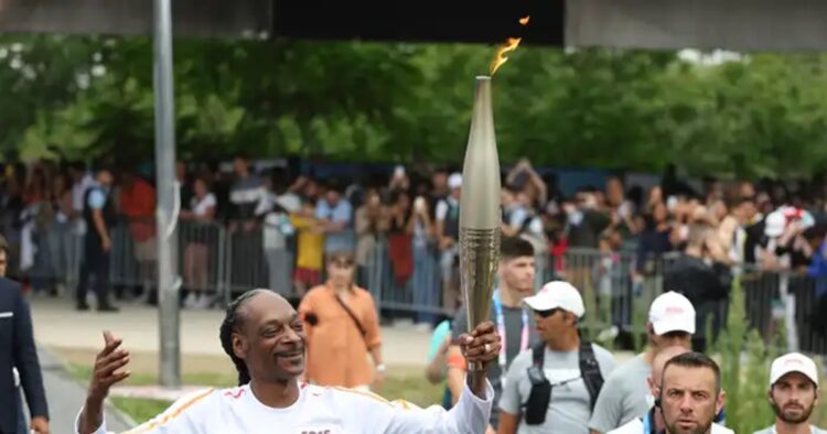 Snoop Dogg has been added in the Paris 2024 torchbearer to that list. He carried the Olympic flame in an area next to the State de France stadium in the northern Parisian suburb of Saint-Denis.