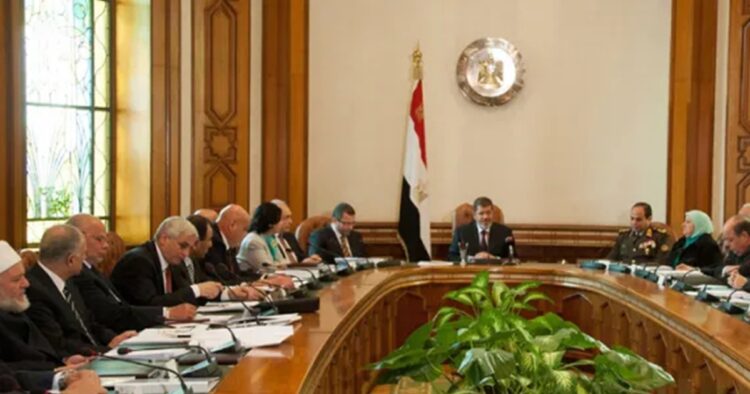 Egypt's new Cabinet was sworn in on Wednesday, addressing economic challenges and regional conflicts. Prime Minister Mustafa Madbouly, in office since 2018, remains at the helm, while significant changes were made in defense and economic portfolios.