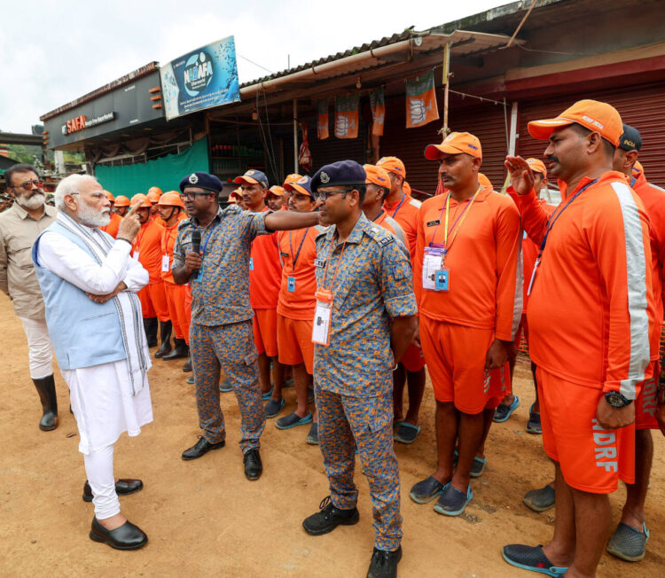 Wayanad, Aug 10 :  Prime Minister Narendra Modi interacts with disaster response teams during his visit to the Landslides affected areas, at Kalpetta in Wayanad on Saturday.