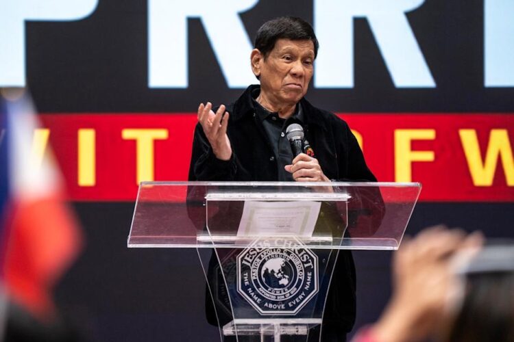 Former President of the Philippines Rodrigo Duterte speaks inside the Southorn Stadium during a thanksgiving gathering organized by Hong Kong-based Filipino workers for the former populist president in Hong Kong on March 9, 2025 (AP Photo/Vernon Yuen, File)