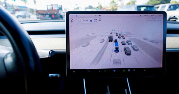 A Tesla Model 3 vehicle drives using FSD (Full Self-Driving) in Encinitas (REUTERS/Mike Blake)