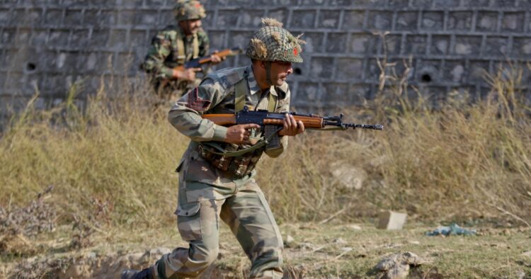 Indian army soldiers during a search operation in a forest area outside the Pathankot air force base in Pathankot. (AP)