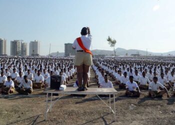 Members of the Rashtriya Swayamsevak Sangh, or RSS, stand at attention and salute a saffron-orange flag at a morning shakha, or drill session, in a park in suburban Mumbai, India.

(Lauren Frayer/NPR)